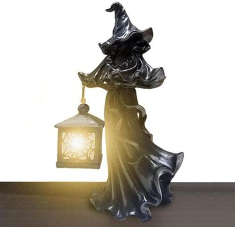 Make a Bewitching Statement this Halloween with a Witch Statue and Lantern